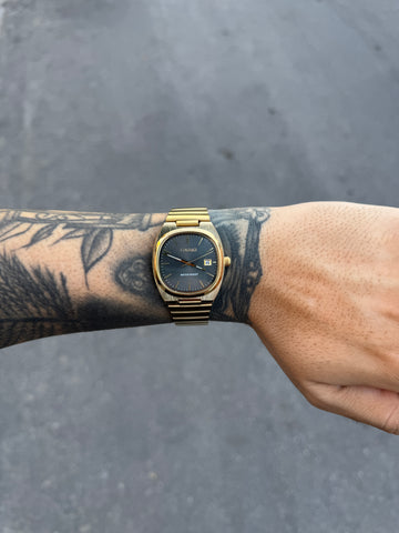 CASIO QUARTZ AQ DOURADO FUNDO PRETO