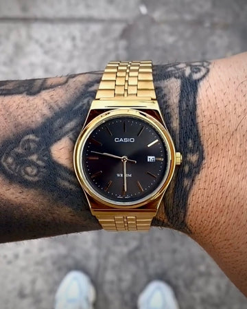 CASIO QUARTZ MTP DOURADO FUNDO PRETO