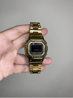 G-SHOCK DW-5600 AÇO DOURADO